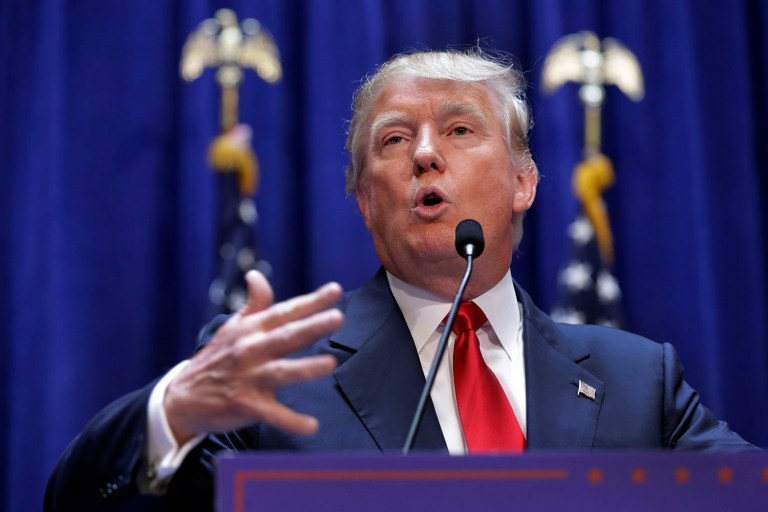 Developer Donald Trump gestures as he announces that he seek the Republican nomination for president, Tuesday, June 16, 2015, in the lobby of Trump Tower in New York. (AP Photo/Richard Drew)