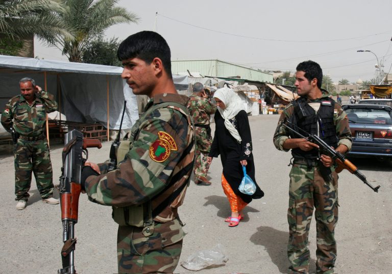 FILE - In this Saturday, March 28, 2009 file photo, Sahwa, or Awakening Council members stand guard in the Dora area of southern Baghdad, Iraq. Over the past month, militants led by the extremist Islamic State group overpowered the military and the Sahwa, seizing control of most of the Sunni-dominated areas of Iraq. The jihadis have systematically killed dozens of former Sahwa leaders, forced others to flee and recruited the remaining foot soldiers through intimidation. (AP Photo/Loay Hameed, File)