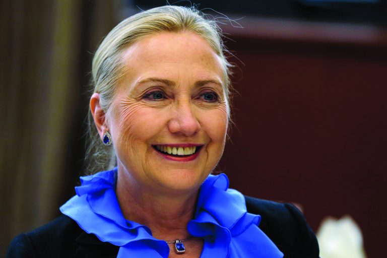 FILE - In this Nov. 16, 2012, file photo, U.S. Secretary of State Hillary Rodham Clinton poses for photographs before dinner at the Ministry of Foreign Affairs in Singapore. The State Department said Sundy, Secretary of State Hillary Rodham Clinton will return to work Monday Jan. 7, 2013, a little over a week after she was hospitalized with a blood clot in her head. (AP Photo/Matt Rourke, File)
