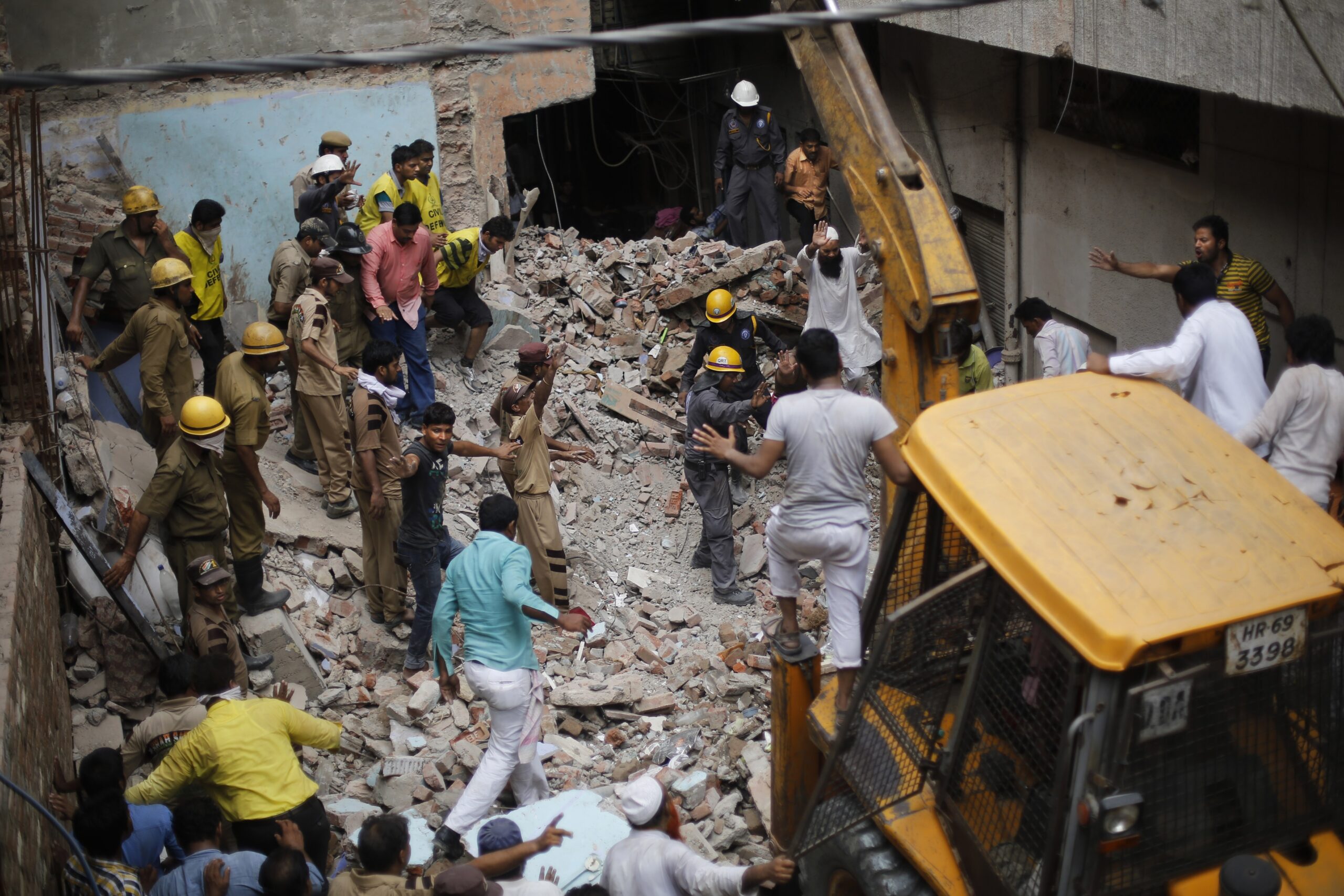 2 buildings topple in India, killing at least 19