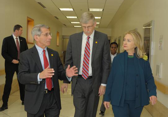 National Institute of Allergy and Infectious Diseases Director Anthony Fauci, left, talks with Hillary Clinton at the NIH campus in 2011. (NIAID, via Flickr)