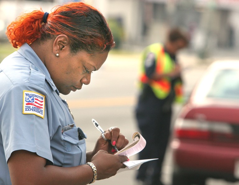 A D.C. police officer writes a traffic ticket. (Examiner file photo)