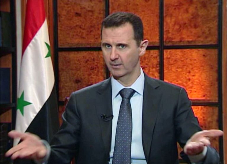 In this image from video broadcast on Syrian state television Wednesday, April 17, 2013, President Bashar Assad speaks during an interview. Syria's president accused the West on Wednesday of backing al-Qaida in his country's civil war, warning it will pay a price 