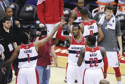 Nick Wass/AP
Nick Young, John Wall and Shelvin Mack helped the Wizards capture their first win in nine tries to improve to 1-8 this season.