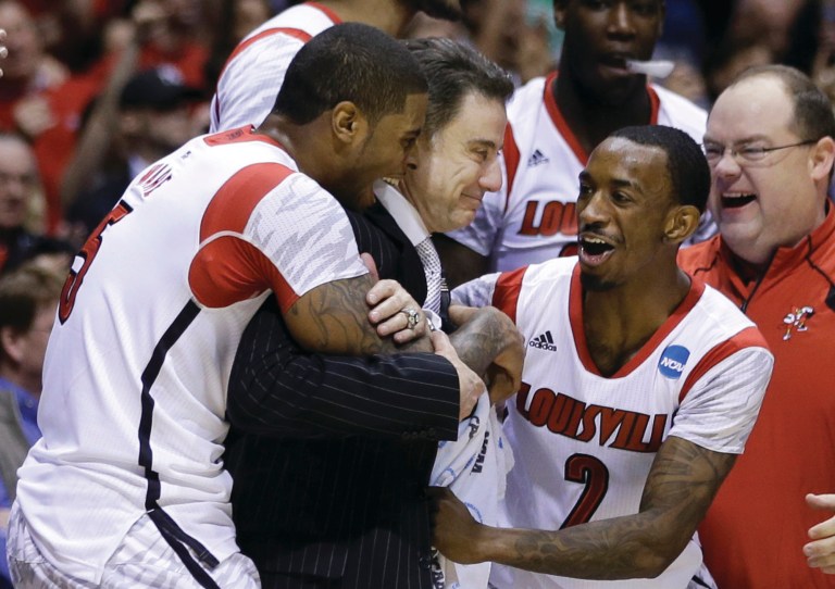Darron Cummings/AP
Chane Behanan, left; Rick Pitino, center; and Russ Smith recovered from Kevin Ware's injury to blow out Duke in the second half.