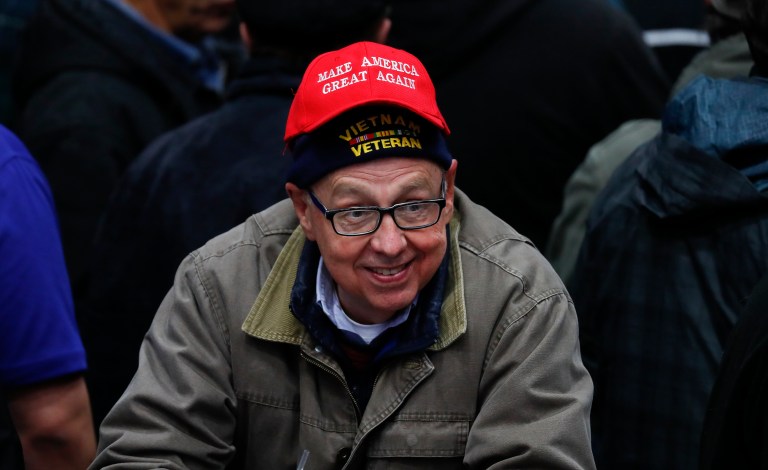 Trump's supporters expect him to get right to work making the slogan come true. (AP Photo/Paul Sancya)