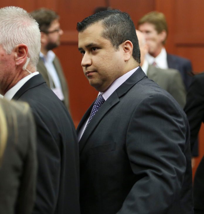 George Zimmerman leaves court with his family after his not guilty verdict was read in Seminole Circuit Court in Sanford, Fla. (AP Photo/Gary W. Green)
