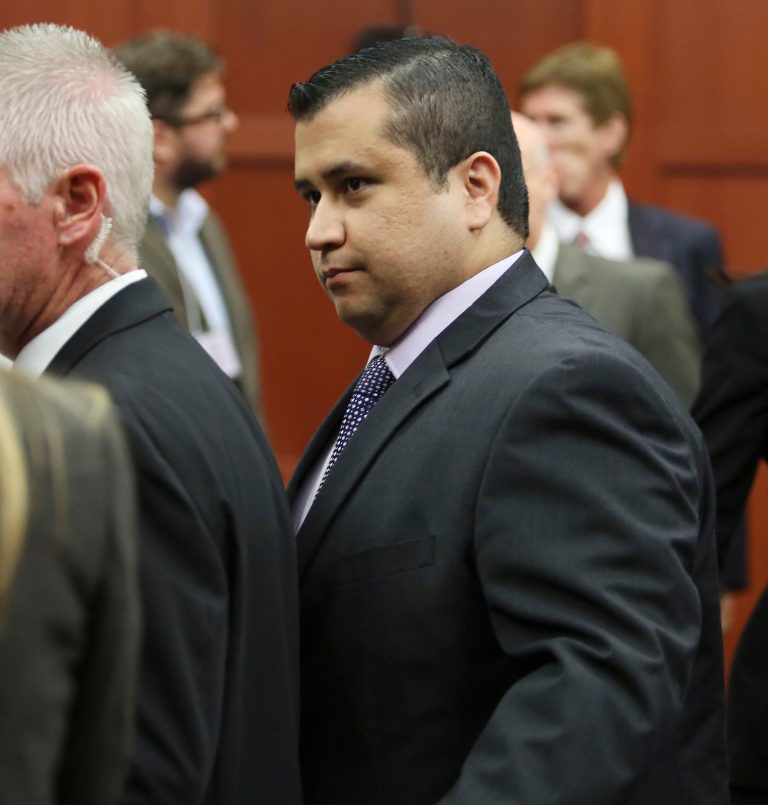 George Zimmerman leaves court with his family after his not guilty verdict was read in Seminole Circuit Court in Sanford, Fla. (AP Photo/Gary W. Green)