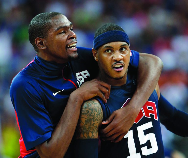 Eric Gay/AP
Carmelo Anthony, right, Kevin Durant and the U.S. will face Spain on Sunday in the gold-medal game.