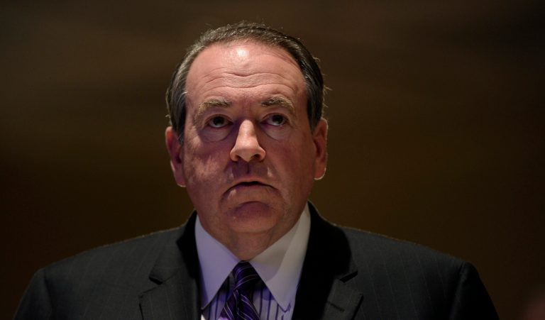 Former Arkansas Gov. Mike Huckabee sits down for lunch before speaking at the Republican National Committee winter meeting in Washington, Thursday, Jan. 23, 2014. Huckabee isn't rushing to have his name included among the crowded field of potential Republican presidential candidates. But he isn't closing the door, either, as he meets Thursday with the GOP's cardinals at the Republican National Committee.(AP Photo/Susan Walsh)