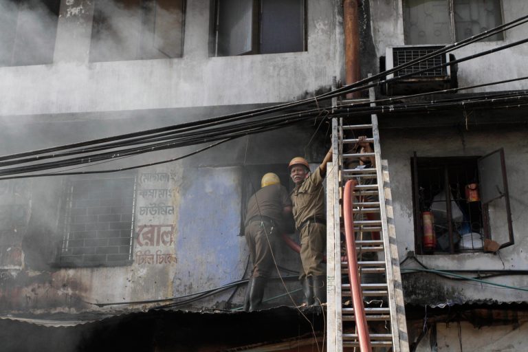 Indian firemen try to douse a fire that broke out early morning at an illegal six-story plastics market in Kolkata, India, Wednesday, Feb. 27, 2013. More than a dozen people were killed and others were hospitalized in critical condition. (AP Photo/Bikas Das)