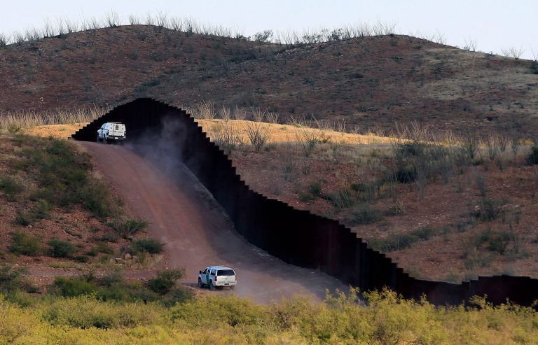 U.S. Border Patrol agents patrolling the border fence near Naco, Ariz. (AP/Ross D. Franklin)