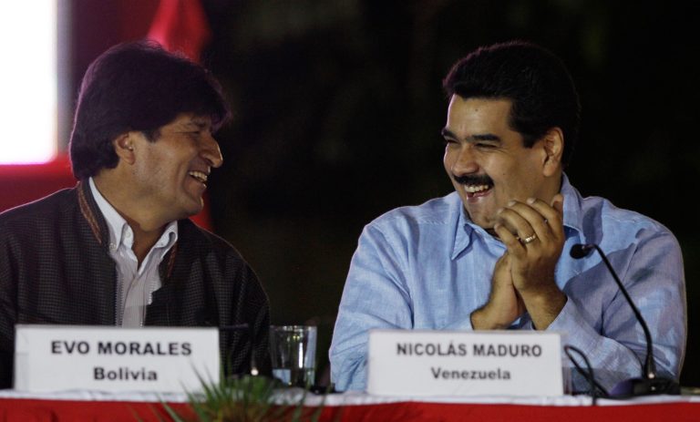   Venezuela's Vice President Nicolas Maduro, right, and Bolivia's President Evo Morales share a laugh during the 8th anniversary of ALBA group in Caracas, Venezuela, Saturday, Dec. 15, 2012. President Hugo Chavez has been receiving daily visits from former Cuban leader Fidel Castro while recovering from cancer surgery in Cuba, a Venezuelan government official said Saturday night. (AP Photo/Fernando Llano)  