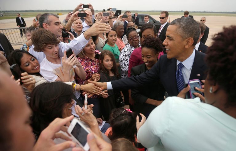 President Barack Obama greets guests on the tarmac upon his arrival on Air Force One at Austin-Bergstrom International Airport, Thursday, May 9, 2013 in Austin, Texas. (AP Photo/Pablo Martinez Monsivais)