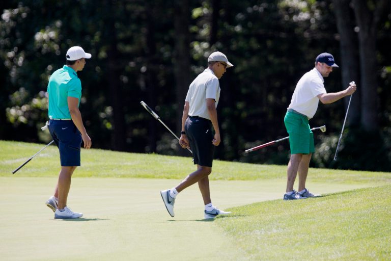 President Barack Obama, center, Cy Walker, left, and Joe Paulsen, right, leave the first green during a round of golf at Farm Neck Golf Course in Oak Bluffs, Mass., on Martha's Vineyard, Sunday, Aug. 7, 2016. (AP Photo/Manuel Balce Ceneta)
