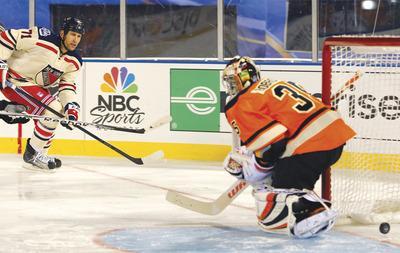 Tom Mihalek/AP
New York forward Mike Rupp scored his second and third goals of the season during the Rangers'come-from-behind victory in the Winter Classic on Monday.