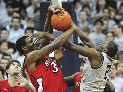Richard Lipski/AP
Jason Clark and Georgetown shot 29.3 percent from the field but still beat Greg Lewis and Rutgers on Saturday afternoon.