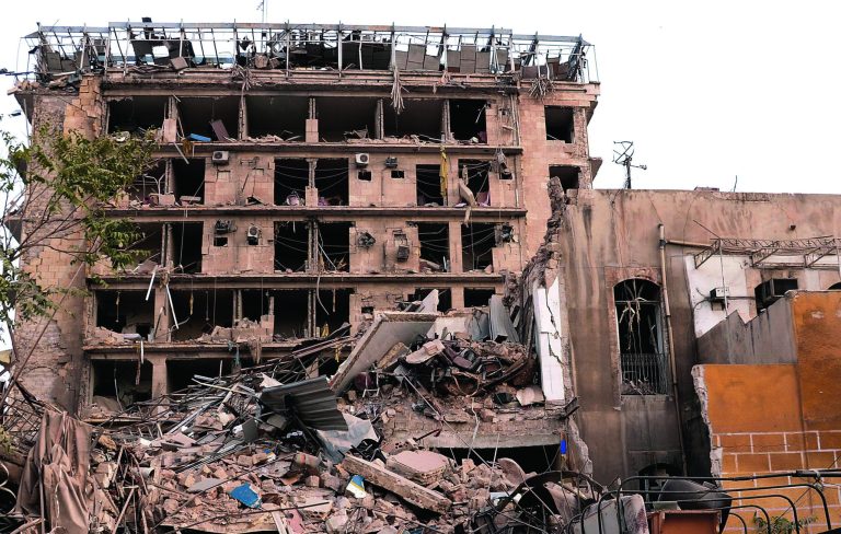 In this photo released by the Syrian official news agency SANA, destroyed buildings at the scene where triple bombs exploded at the Saadallah al-Jabri square, in Aleppo city, Syria, Wednesday Oct. 3, 2012. Three powerful explosions rocked the main square in a government-controlled central district of Aleppo on Wednesday, the Syrian state-run TV said. Activists reported multiple casualties and heavy material damage. (AP Photo/SANA)