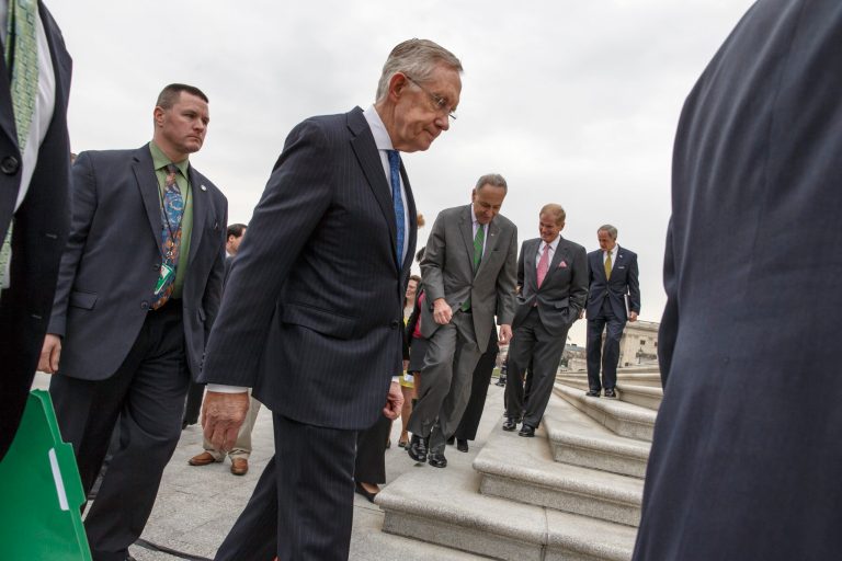 Senate Majority Leader Harry Reid, D-Nev., and other Democrats leave a news conference after urging approval for raising the minimum wage, at the Capitol in Washington, April 2, 2014. From center to right are Sen. Reid, Sen. Chuck Schumer, D-N.Y., Sen. Bill Nelson, D-Fla., and Sen. Tom Carper, D-Del. (AP Photo/J. Scott Applewhite)