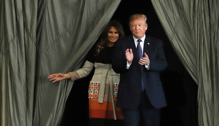 President Trump and first lady Melania Trump arrive at the stage in order to greet the U.S. military personnel and the members of Japan Self Defense Forces upon his arrival at the U.S. Yokota Air Base on the outskirts of Tokyo. (AP Photo/Eugene Hoshiko)
