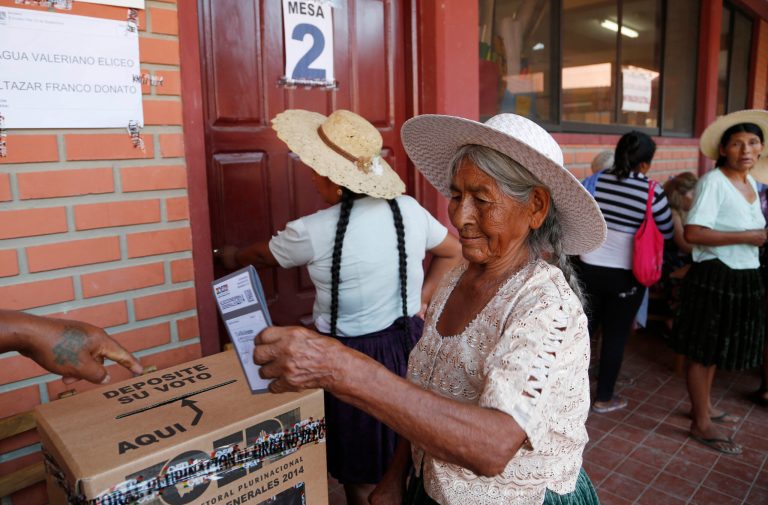 A woman casts her ballot at a polling station in Villa 14 de Septiembre, in the Chapare region, Bolivia, Sunday, Oct. 12, 2014. Bolivia is holding general and presidential elections Sunday with President Evo Morales appearing to be  headed to an unprecedented third term.(AP Photo/Juan Karita)