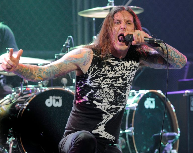 FILE - In this file photo taken Thursday, April 8, 2010, Tim Lambesis of As I Lay Dying performs at the second annual Revolver Golden Gods Awards in Los Angeles. Authorities say the singer of Grammy-nominated heavy metal band As I Lay Dying has been arrested Tuesday May 7, 2013 in Southern California after trying to hire an undercover detective to kill his estranged wife. The San Diego County Sheriff's Department says in a statement that 32-year-old Tim Lambesis was arrested Tuesday in Oceanside. (AP Photo/Chris Pizzello, File)