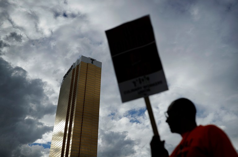 The hotel, which is co-owned by its namesake, Republican presidential nominee Donald Trump, has refused to deal with the union for a year, saying it didn't fairly win a worker election. (AP Photo)