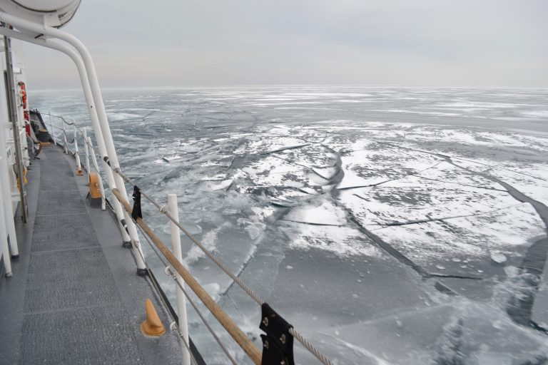 FILE - In this Feb. 12, 2014 file photo the Coast Guard Cutter Biscayne Bay, a 140-foot ice-breaking tug, sails through ice covered waters toward the shores off Indiana. U.S. Steel said Monday, April 7, 2014 that its largest mill in Gary, Ind., is on limited production after a shortage of vital iron ore due to the ice covering Lake Superior had temporarily shut down its furnaces. (Coast Guard photo by Chief Petty Officer Alan Haraf, File)
