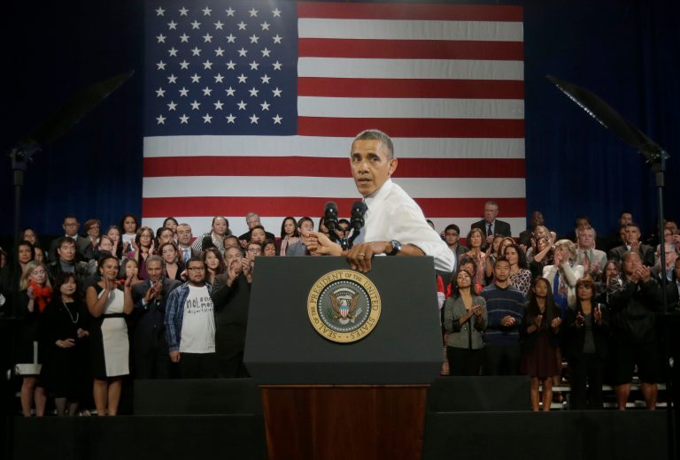 President Obama turns around to respond to hecklers interrupting his speech about immigration reform, Monday, Nov. 25, 2013, at the Betty Ann Ong Chinese Recreation Center in San Francisco. (AP Photo/Pablo Martinez Monsivais)
