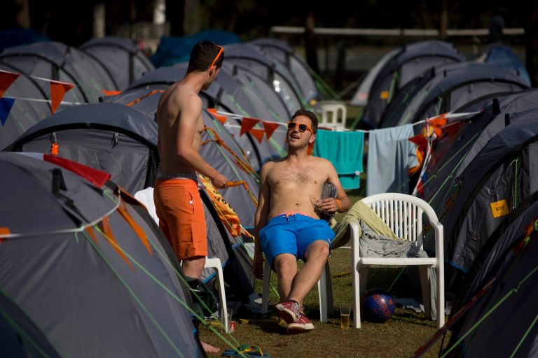 In Brazil camp for Dutch fans, color helps unite