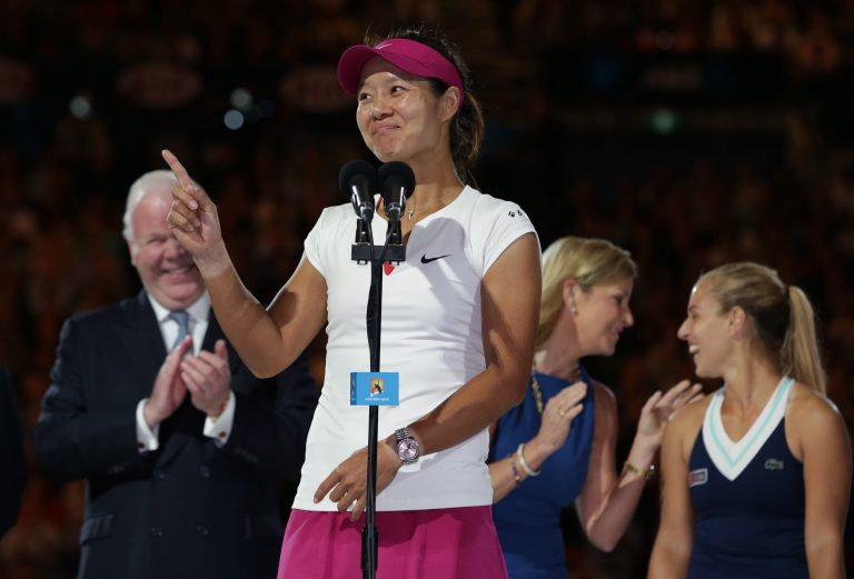 Li Na of China speaks after defeating Dominika Cibulkova of Slovakia, right,  in their women's singles final at the Australian Open tennis championship in Melbourne, Australia, Saturday, Jan. 25, 2014. (AP Photo/Aaron Favila)