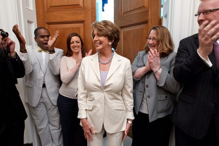 House Minority Leader Nancy Pelosi of Calif. relays the news to her staff that the Supreme Court had just upheld the Affordable Care Act, Thursday, June 28, 2012, on Capitol Hill in Washington. Pelosi, the former speaker of the House, was instrumental in helping to pass health care reform in Congress and was at President Obama's side when he signed it into law. (AP Photo/J. Scott Applewhite)