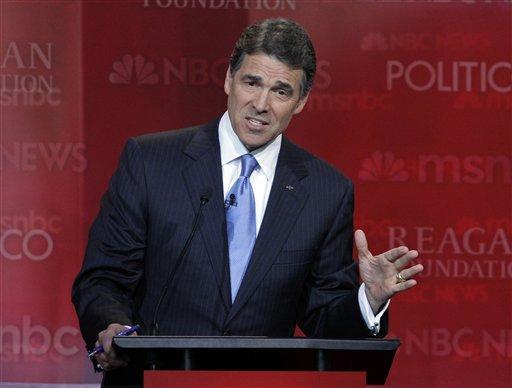 Perry endures shots from rivals in first debate