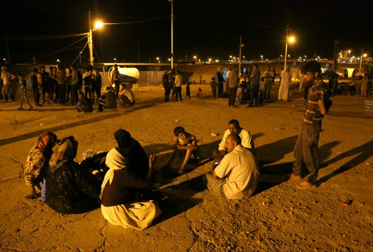 Displaced Iraqis from the Yazidi community settle at the camp of Bajid Kandala at Feeshkhabour town near the Syria-Iraq border. (AP Photo/ Khalid Mohammed)