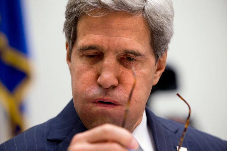 Secretary of State John Kerry removes his glasses and sighs prior to beginning testimony on Capitol Hill in Washington, Tuesday, Sept. 10, 2013, before the House Armed Services Committee hearing on the proposed authorization to use military force in Syria. (AP Photo/Jacquelyn Martin)