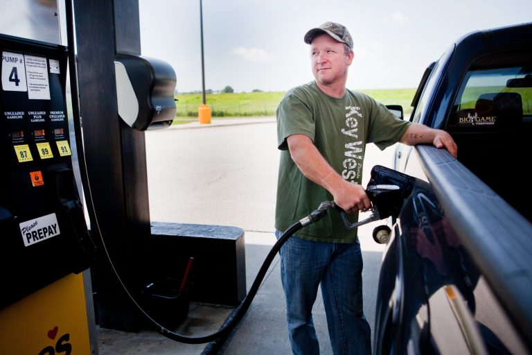 FILE - In this July 1, 2014 file photo, Lance Thompson pumps gas into his truck at a Love's station in St. Joseph, Mo. The price of oil fell for the ninth straight day Wednesday, July 9, 2014, despite continued turmoil in the Middle East, a drop that could lead to lower gasoline prices for U.S. drivers in the weeks ahead.  (AP Photo/St. Joseph News-Press, Sait Serkan Gurbuz, File)