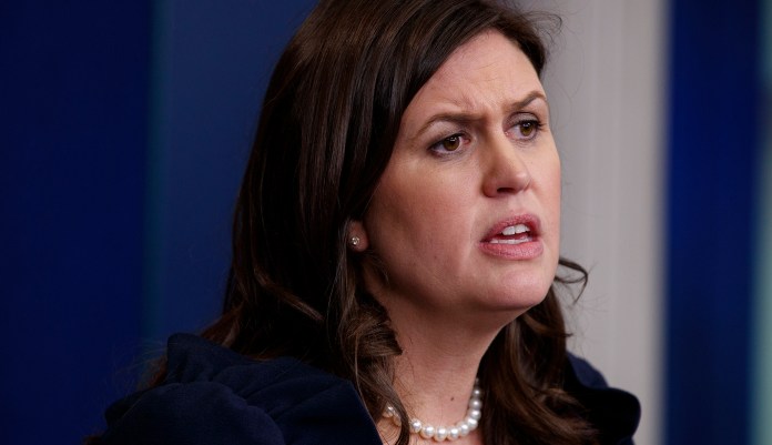 "You guys are absolutely obsessed with everything to do with collusion," Sarah Sanders said on Tuesday. "We hope that you'll take some of that same obsession, energy and direct it to the places where it looks like there could have been inappropriate and possibly illegal behavior." (AP Photo/Evan Vucci)