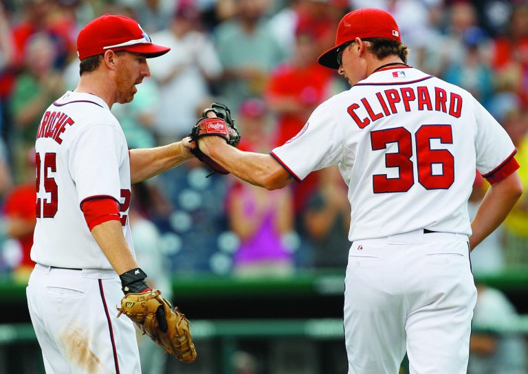Carolyn Kaster/AP
Washington Nationals closer Tyler Clippard  celebrates with first baseman Adam LaRoche after LaRoche got the final out, unassisted, on a ground ball to first off the bat of Miami Marlins' Jose Reyes in the top of the ninth inning during Game 1 of a doubleheader on Friday. The Nationals won 7-4.
