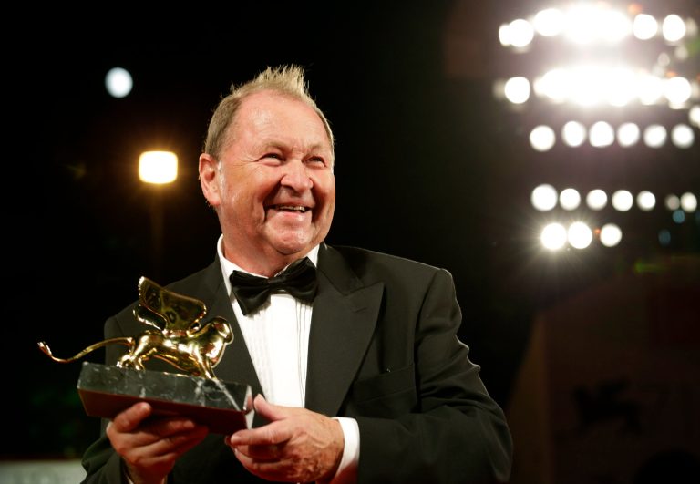 Director Roy Andersson poses for photographers with his Golden Lion for Best Film for his movie A Pigeon Sat On A Branch Reflecting On Existence following the awards ceremony of the 71th edition of the Venice Film Festival in Venice, Italy, Saturday, Sept. 6, 2014. (AP Photo/David Azia)