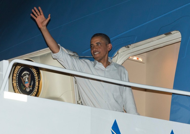 President Obama boards Air Force One at Honolulu Joint Base Pearl Harbor-Hickam in Honolulu in December 2012. (AP Photo/Carolyn Kaster)