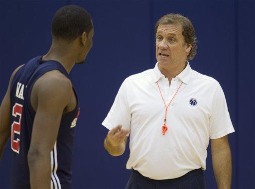 Washington Wizards head coach Flip Saunders, right, talks with point guard John Wall during practice at NBA basketball media day, Thursday, Dec. 15, 2011 in Washington.