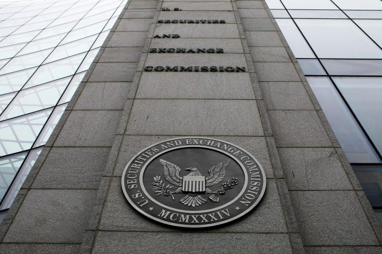 FILE- This Dec. 17, 2008 file photo shows the exterior of the Securities and Exchange Commission (SEC) headquarters in Washington. An American judge for the U.S. Securities & Exchange Commission has ruled the China arms of global accounting firms should be barred from providing audits for U.S.-traded companies in a dispute that might force major corporate names such as oil giant PetroChina and search engine Baidu to withdraw from American stock exchanges. (AP Photo, File)