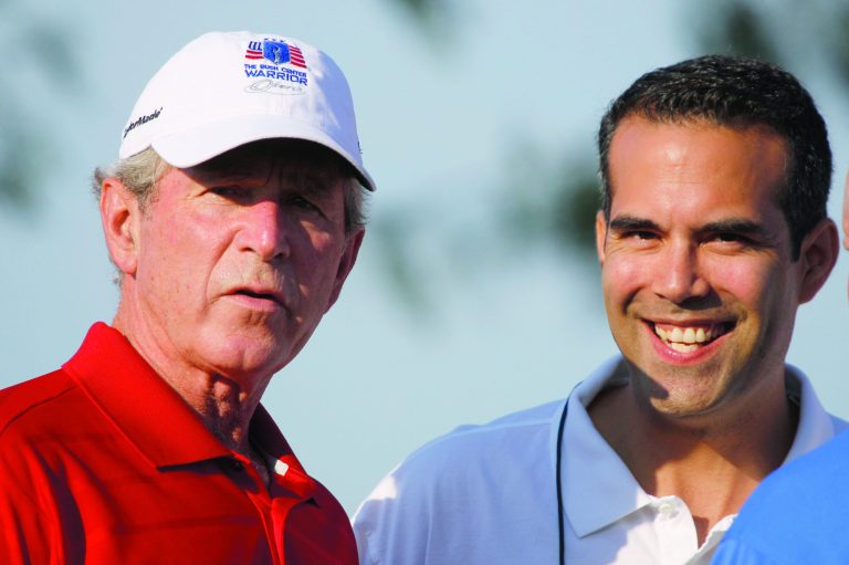 FILE - In this Monday, Sept. 24, 2012, file photo George P. Bush, right, stands with his uncle former President George W. Bush, left, during the Bush Center Warrior Open in Irving, Texas. George P. Bush, the 36-year-old attorney from Fort Worth and son of former Florida Gov. Jeb Bush has taken steps toward seeking elected office in Texas, and his father has said his son is considering a run for the state's land commissioner. (AP Photo/LM Otero, File)