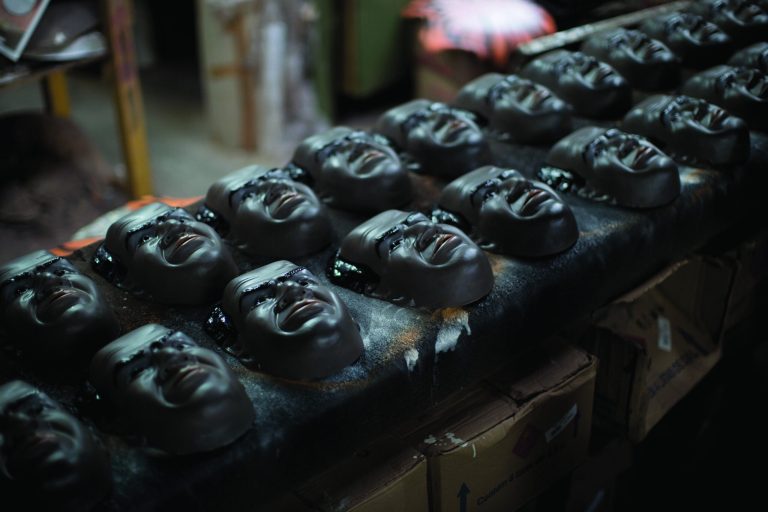 In this Jan. 21, 2013 photo, Carnival masks in the likeness of Brazilian Supreme Court Justice Joaquim Barbosa air drys on an assembly line at the Condal factory in Sao Goncalo, near Rio de Janeiro, Brazil. Condal is Brazil's oldest and most productive mask factory that is run by Olga Valles, a family business started in 1958. Barbosa, born into poverty, became the first black judge in the nation's top court when he took office in 2003. Barbosa went on to make a name for himself when he presided over a wide-ranging political corruption trial involving a cash-for-votes scheme. Now, average Brazilians are honoring him during Carnival by buying his mask in droves, said Valles. Brazil's annual five-day extravaganza begins Friday. (AP Photo/Felipe Dana)