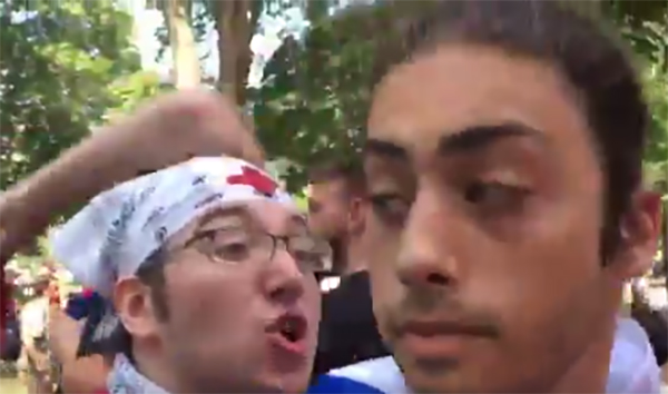 A man wearing an Israeli flag as a cape can be seen in a video shared by Univision's Jessica Weiss, walking through a crowd of protesters. One person rips off his 
