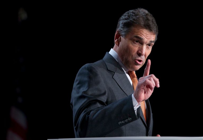 Perry digs at Romney’s faith