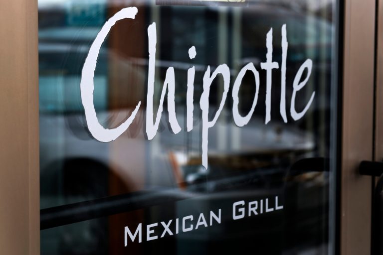This Tuesday, Jan. 28, 2014, photo, shows the door on a Chipotle Mexican Grill in Robinson Township, Pa. Chipotle reports quarterly earnings on Thursday, Jan. 30, 2014. (AP Photo/Gene J. Puskar)