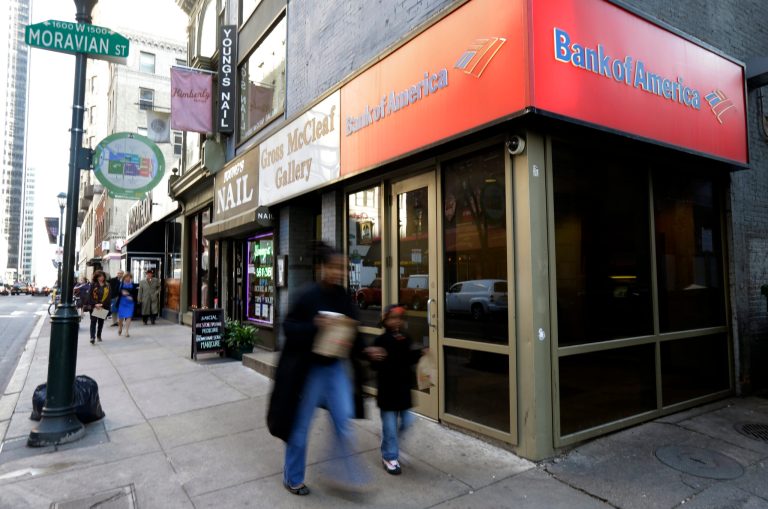   In this Wednesday, Dec. 19, 2012 photo, people walk past a Bank of America branch in Philadelphia. U.S. banks are closing the year with the strongest profits since 2006 and fewer failures than at any time since the financial crisis struck in 2008. They're helping support an economy slowed by high unemployment, flat pay, sluggish manufacturing and anxious consumers. (AP Photo/Matt Rourke)  