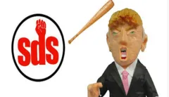 Students bash Trump piñata to protest one year in office