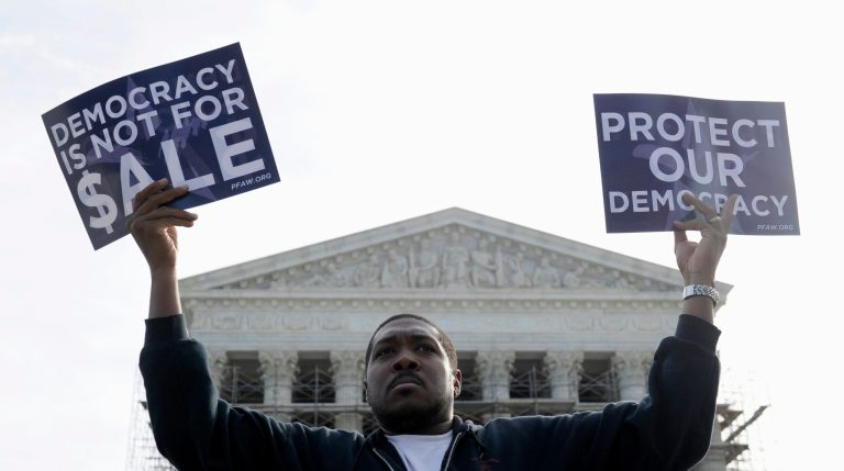 A man takes part in a demonstration outside the Supreme Court building in Washington on Oct. 8. (AP Photo/Susan Walsh, File)